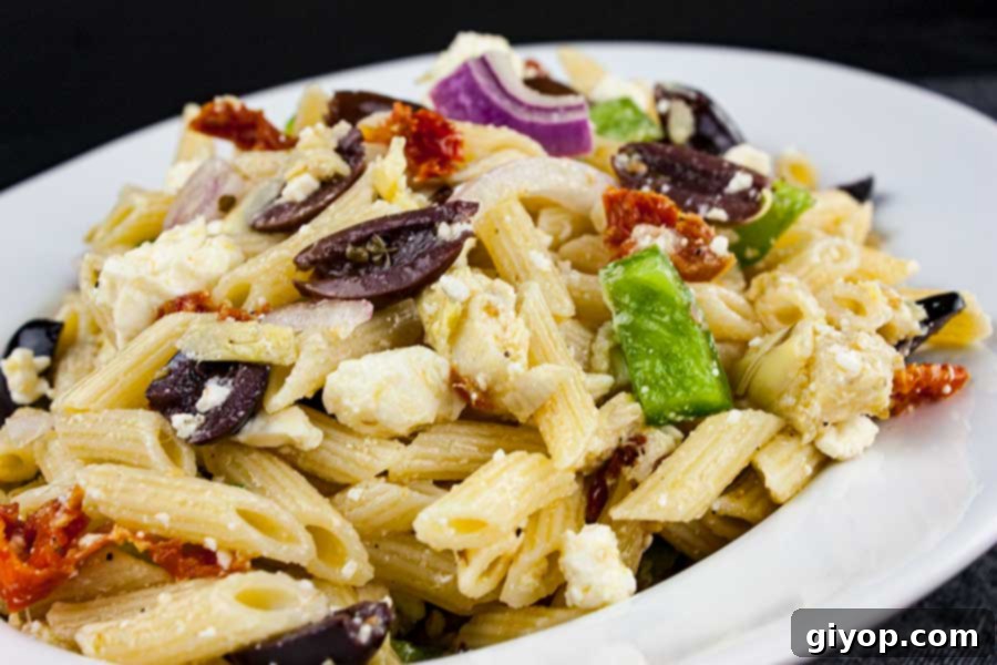 Zesty Greek Pasta Salad 5 A serving of Greek Pasta Salad, highlighting its fresh ingredients and suitability as a meal or side, perfect for any season.