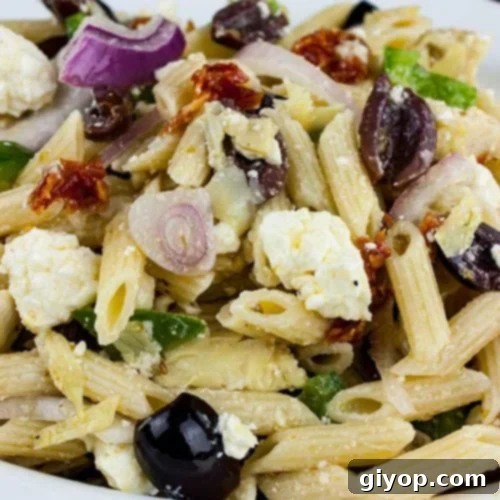 Zesty Greek Pasta Salad 6 Greek Pasta Salad in a white bowl.