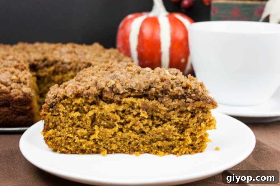 Slice of coffee cake on a white plate.