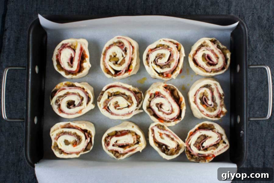 Muffuletta spirals. Cut into 12 equal shapes waiting to go into the oven