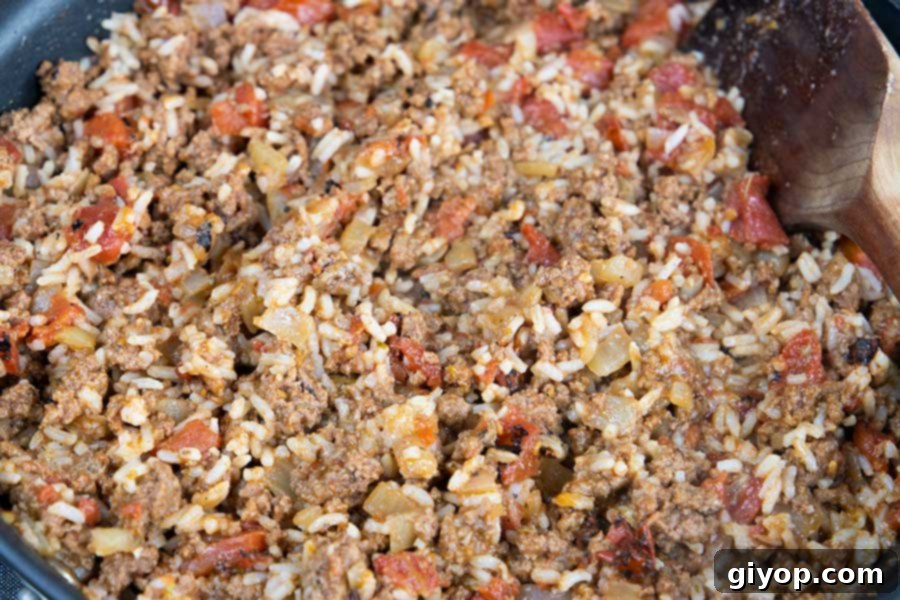 A beef and rice mixture in a skillet.