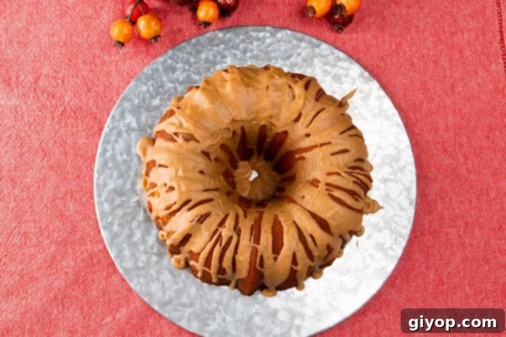 Cider-Glazed Apple Pound Cake 2 Beautifully glazed apple cider pound cake on a elegant silver plate, ready to be served.
