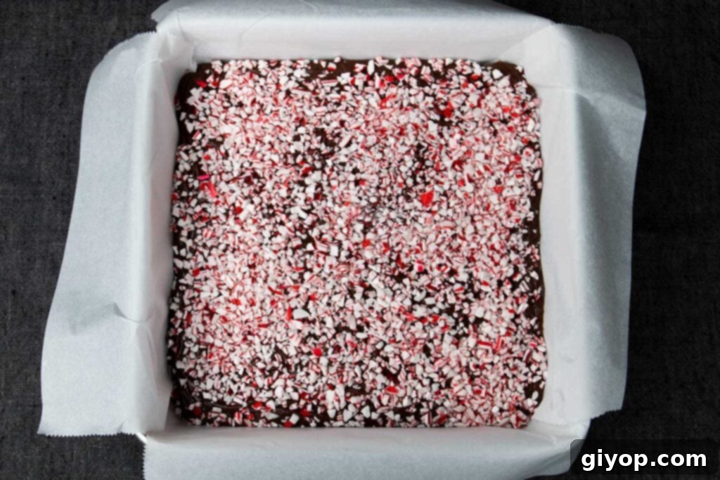 Decadent Easy Peppermint Fudge 4 Peppermint fudge in a lined baking pan.