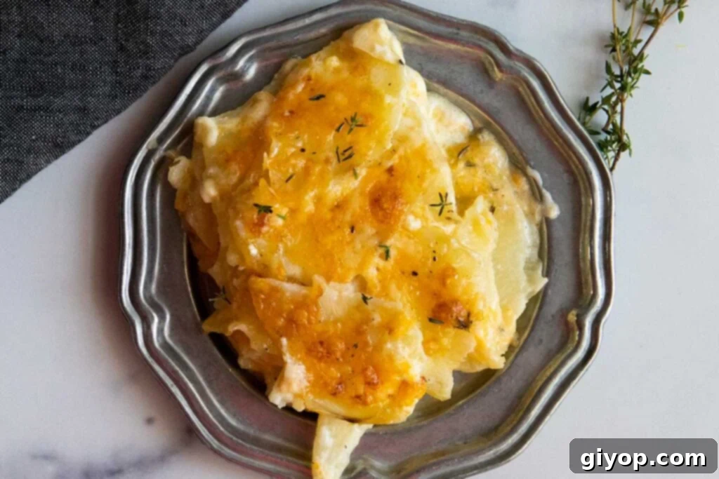 Potatoes Au Gratin with Gruyere cheese on a pewter platter