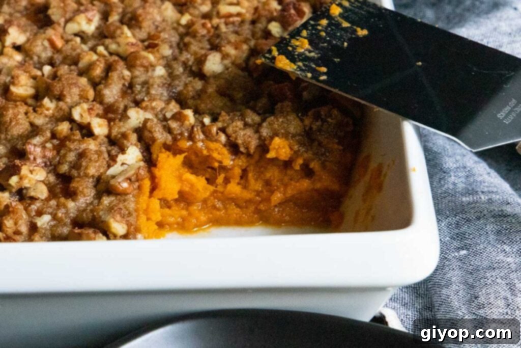 Delicious sweet potato casserole in a pristine white baking dish, ready to be served.