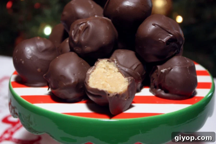 Timeless Chocolate Peanut Butter Delights 8 Peanut butter balls stacked on a red and green plate, showcasing their chocolate coating.