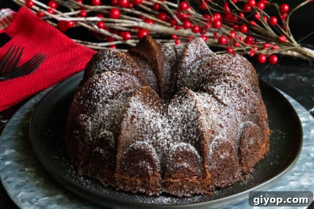 Gramercy Tavern gingerbread on black and silver platter, showcasing its rich, dark color and moist texture.