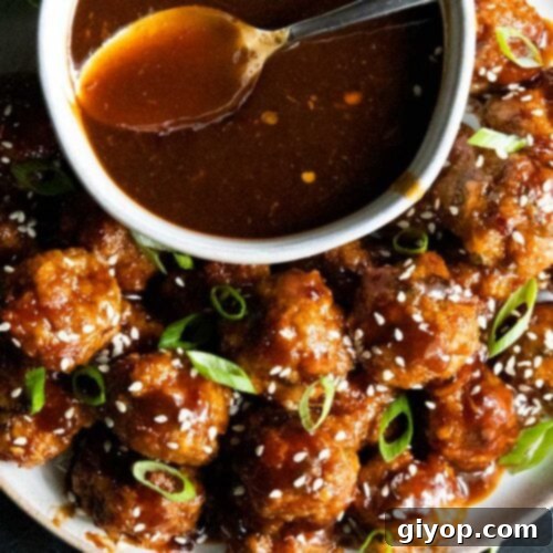 Asian inspired meatballs with sauce.