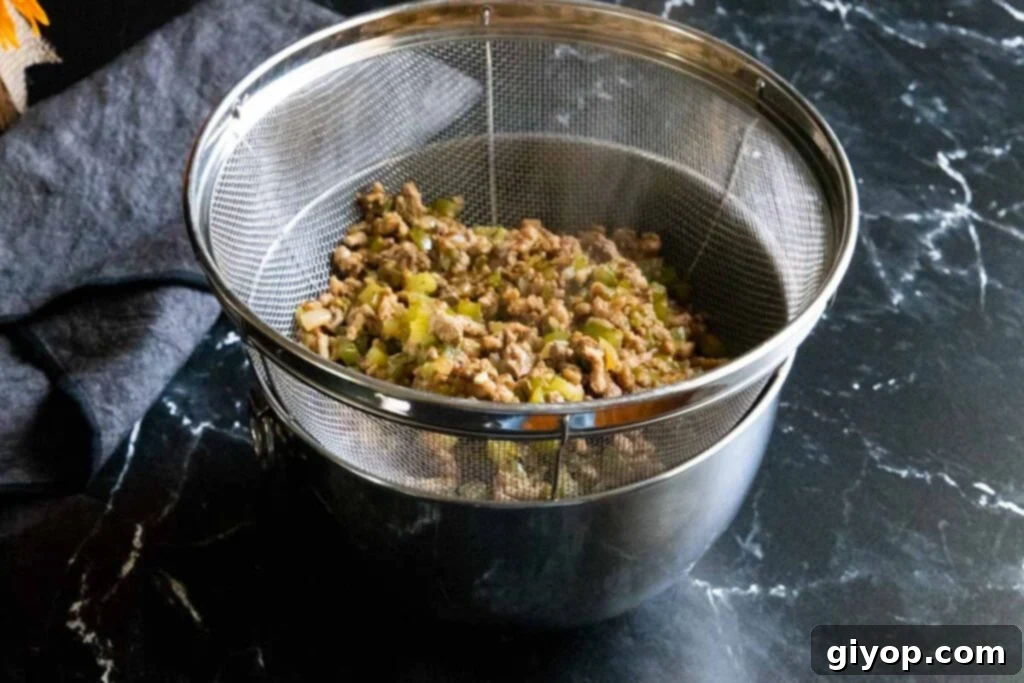 Crafting Perfect Cajun Dirty Rice 6 Meat mixture for dirty rice, draining excess liquid