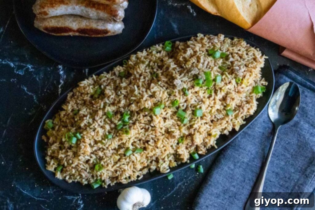 Crafting Perfect Cajun Dirty Rice 9 An overhead shot of some cajun dirty rice with bread and sausages