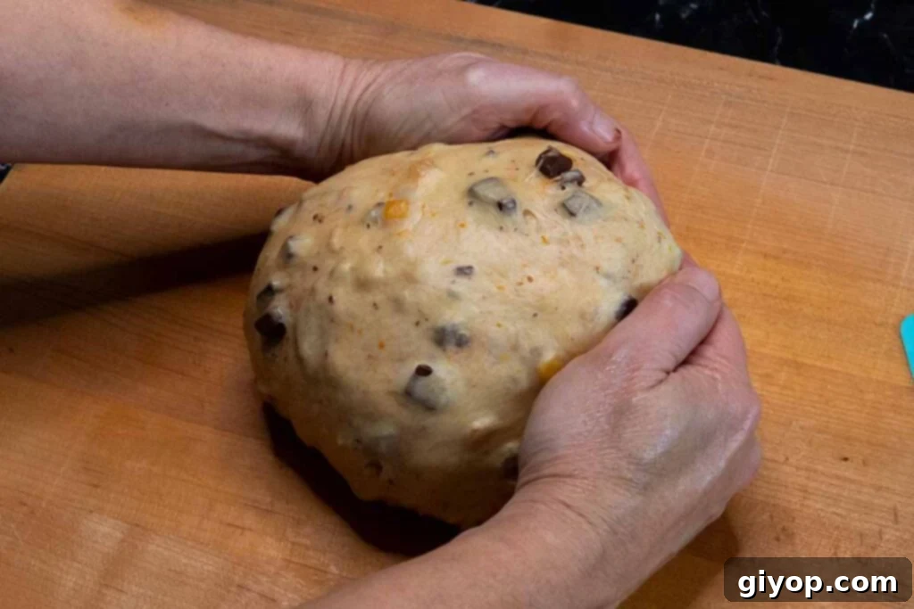 Decadent Chocolate Orange Panettone 13 The final step of rolling the panettone dough into a smooth ball.
