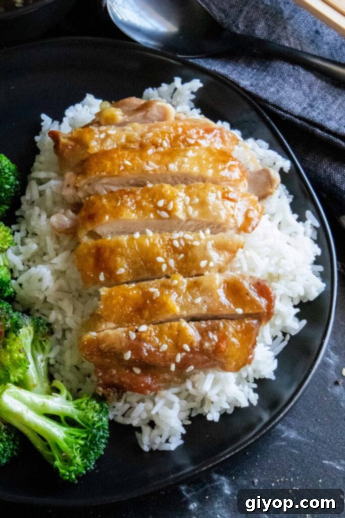Sticky Crispy Teriyaki Chicken Thighs 3 Crispy Chicken Teriyaki on a bed of fluffy rice, a satisfying meal.