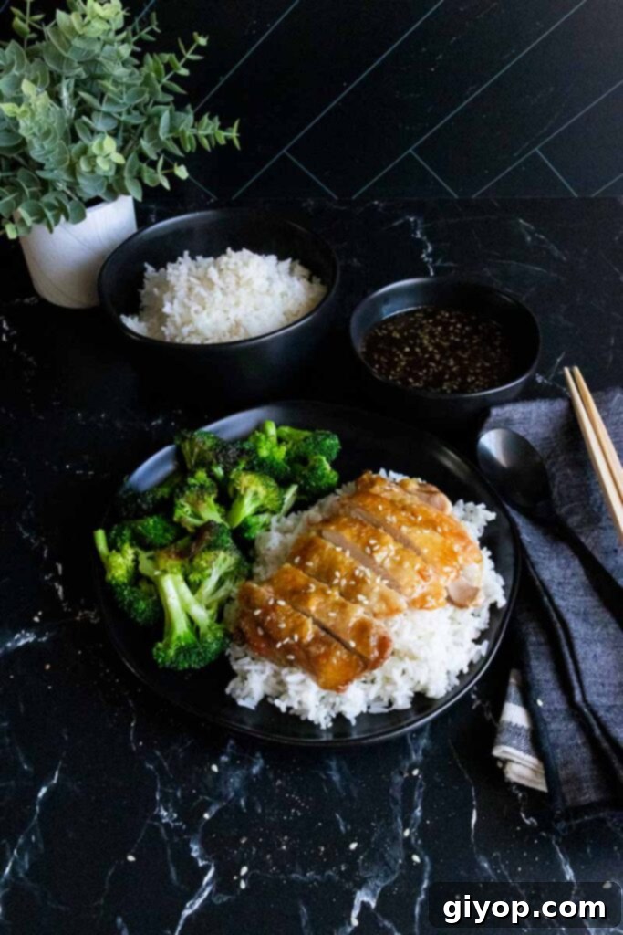 Sticky Crispy Teriyaki Chicken Thighs 4 Chicken teriyaki thighs with rice and broccoli, ready to serve.