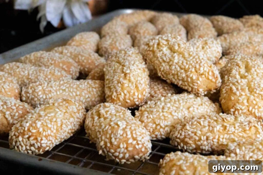 Italian sesame seed cookies on baking sheet.