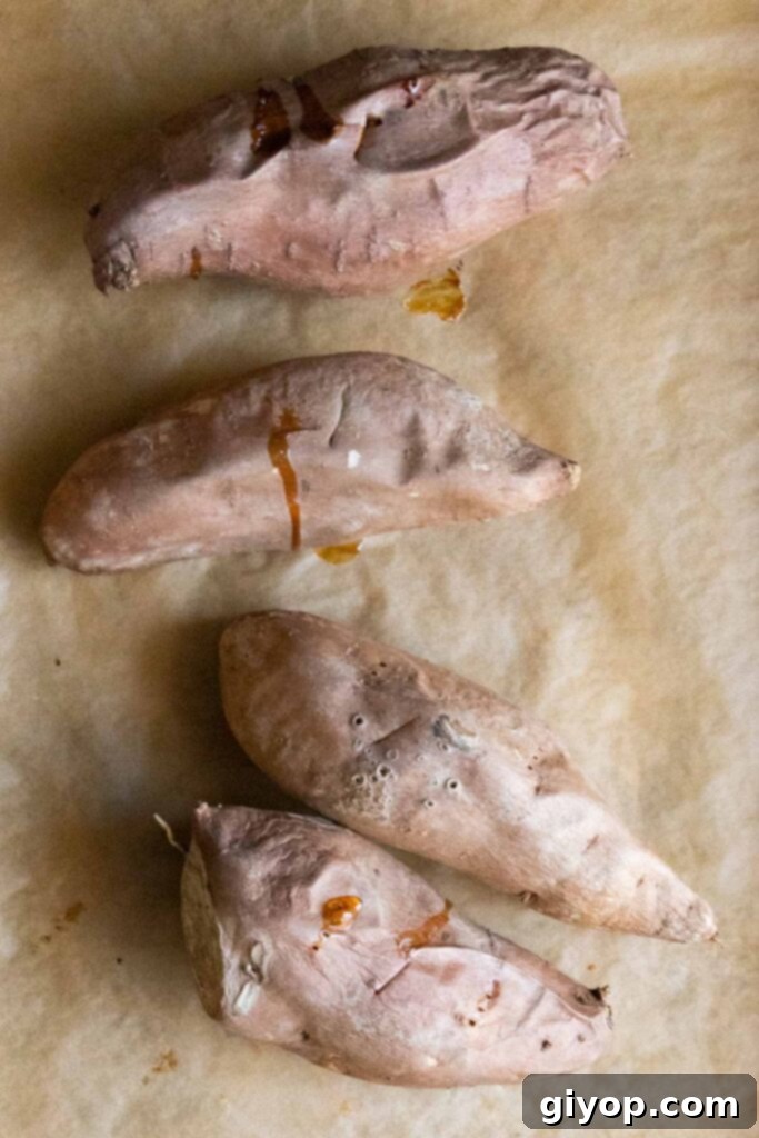 Southern Comfort Sweet Potato Pie 4 baked sweet potatoes on parchment lined baking sheet