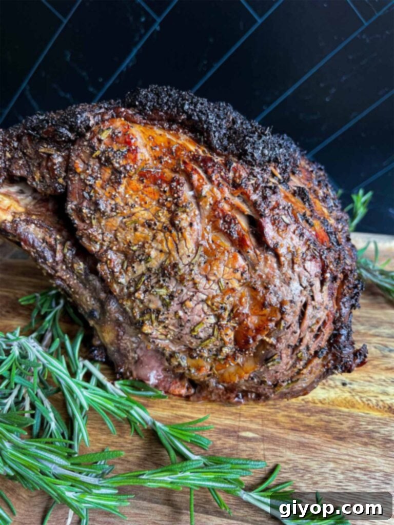 Cooked prime rib on a wooden cutting board.