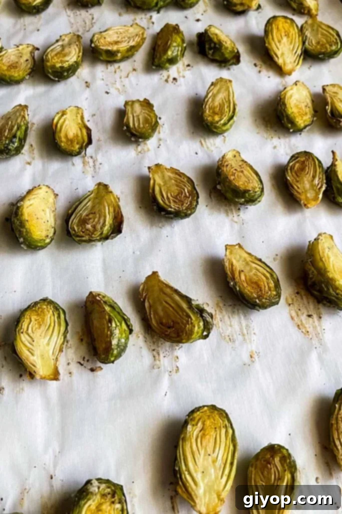 Roasted brussels sprouts on baking tray.