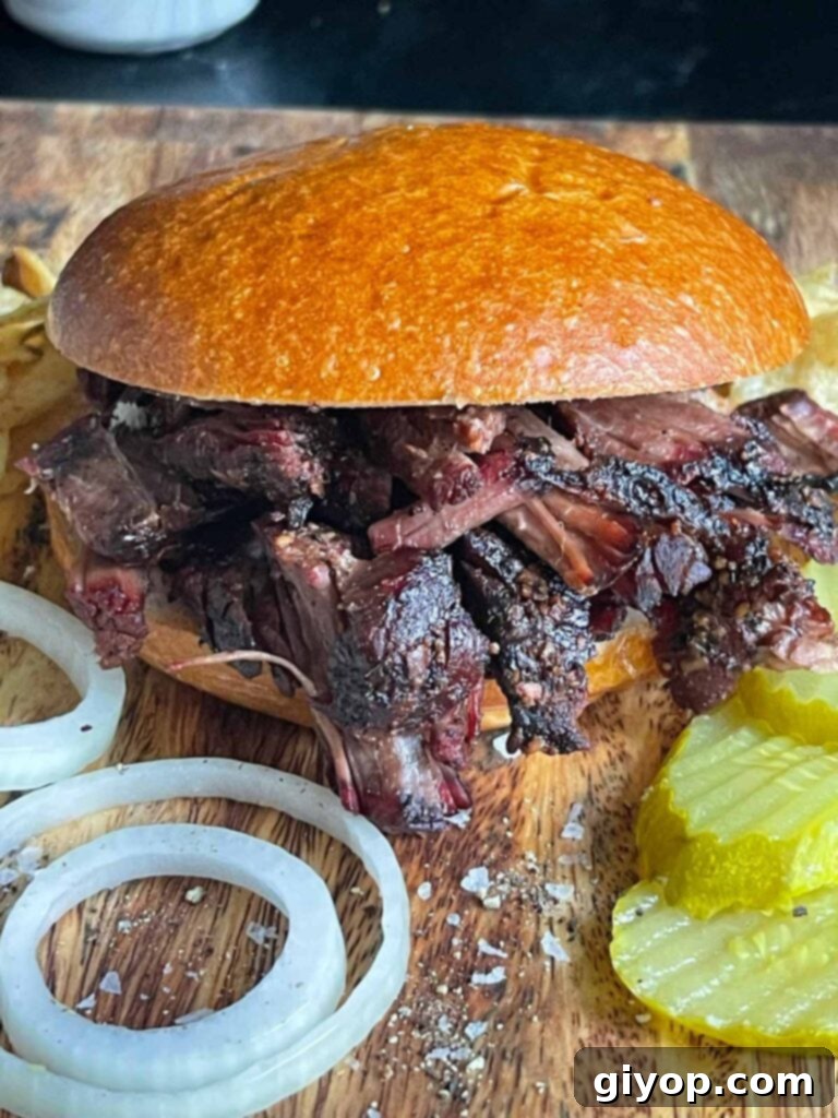 A pulled beef sandwich made from leftover smoked chuck roast.