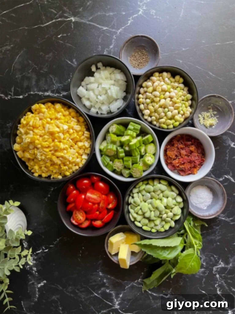 A detailed view of fresh ingredients for Summer Succotash, including corn, okra, beans, and herbs, arranged on a dark rustic surface.