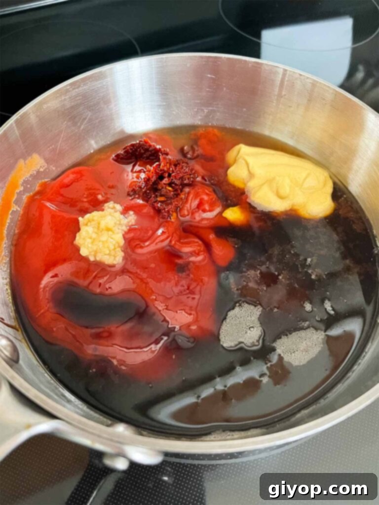 Ingredients for bourbon chipotle barbecue sauce on the stovetop.