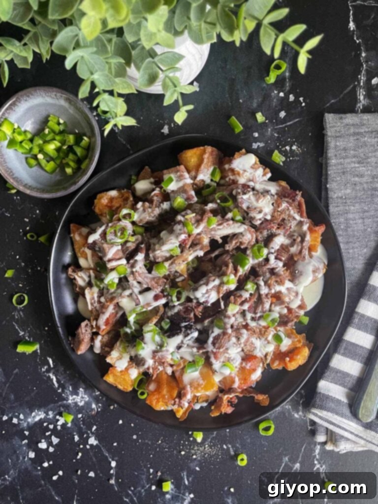 Close-up of decadent loaded potato bites, showcasing crispy edges and abundant toppings.