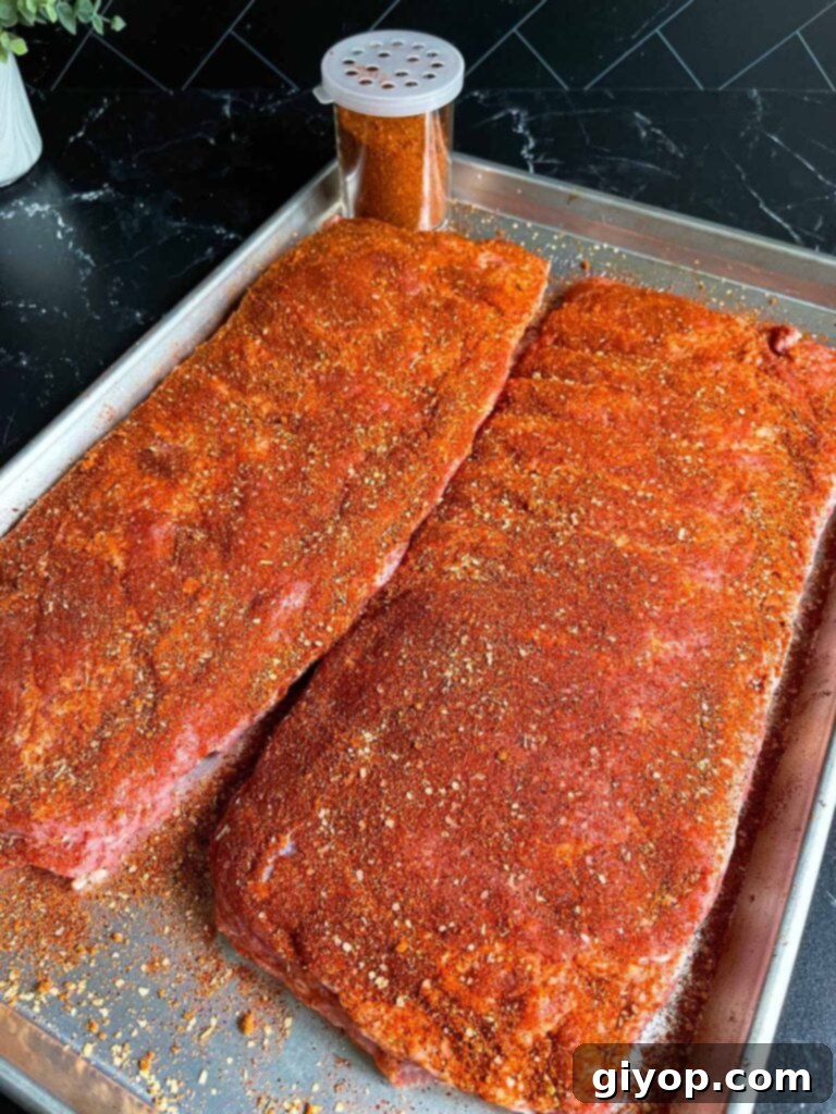 St. Louis style ribs, generously coated with rub, awaiting the smoker.