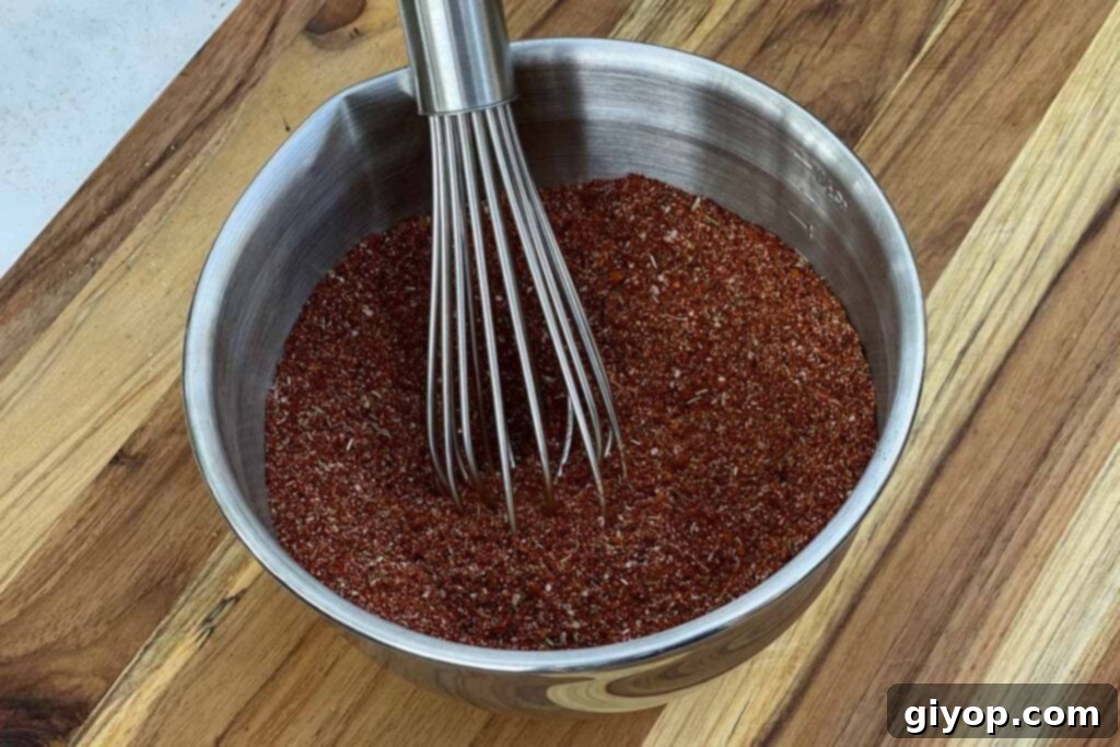 A vibrant dry rub for ribs and pork butt, ready for application.