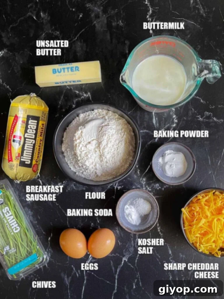 A close-up shot of a single homemade sausage muffin, revealing its golden crust and delicious, cheesy interior.