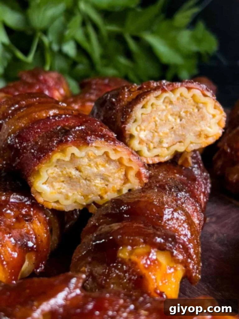 Pitmaster's Smoked Shotgun Shells 2 Smoked shotgun shells on a wooden cutting board with one of them cut in half so you can see a cross section.