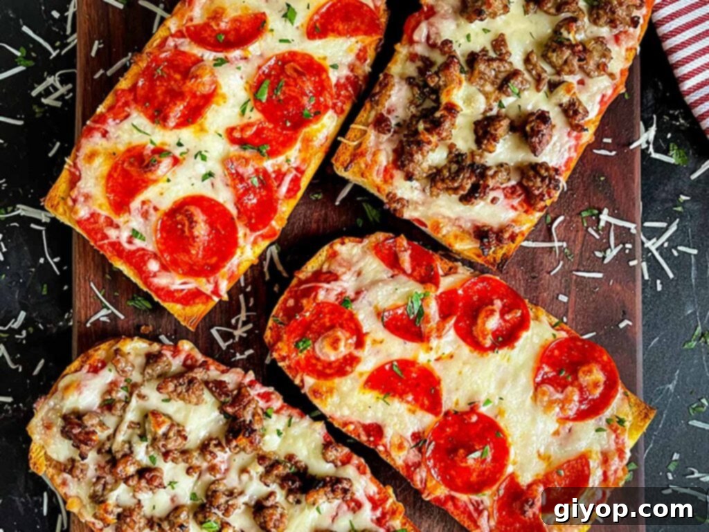 French bread pizza with pepperoni and Italian sausage on a dark wooden cutting board, ready to be served.