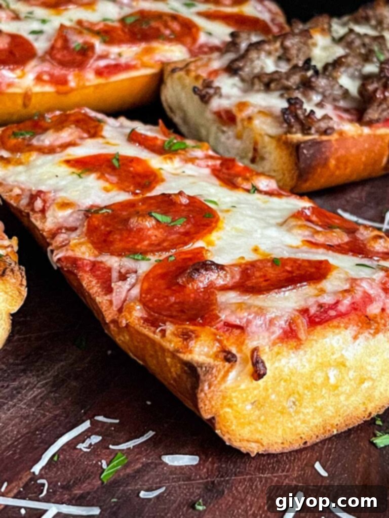 A perfectly baked pepperoni French bread pizza on a wooden cutting board, sliced and ready to eat.