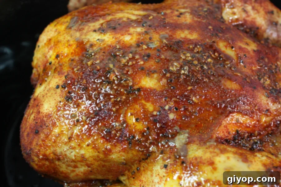 Slow cooker roasted chicken in a crock pot, ready to serve.