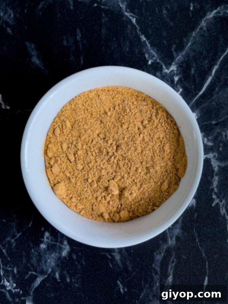 Ultimate Dry Brined Spatchcock Turkey 6 A ramekin filled with ground spices.