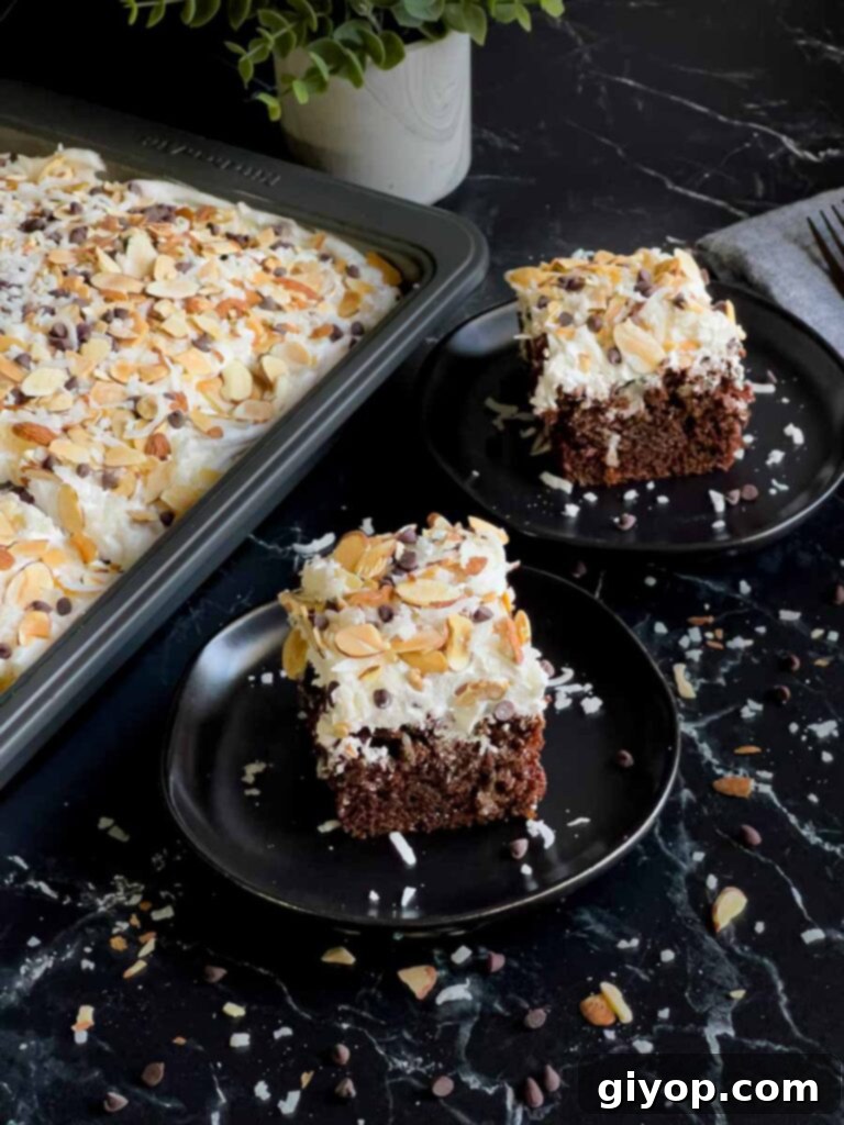 Multiple slices of Almond Joy cake on dark plates, with the remaining cake in the pan nearby.