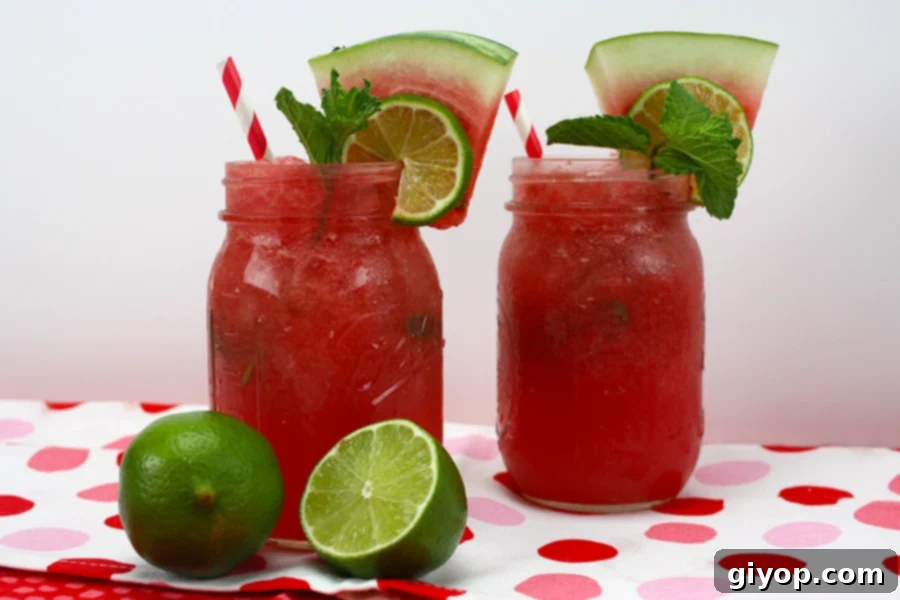 Vibrant Watermelon Mojitos served in large mason jars, garnished with fresh mint and lime slices, set against a bright summer backdrop.