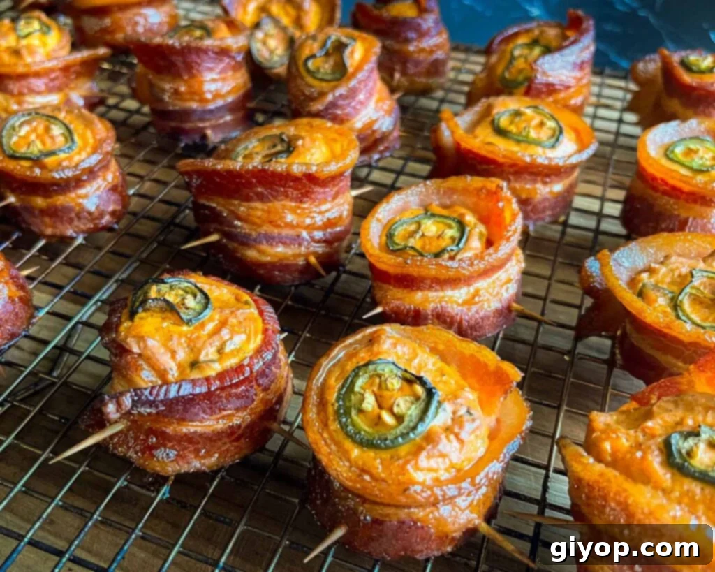 Pitmaster's Piggy Poppers 14 Smoked pig shots on a wire cooling rack.