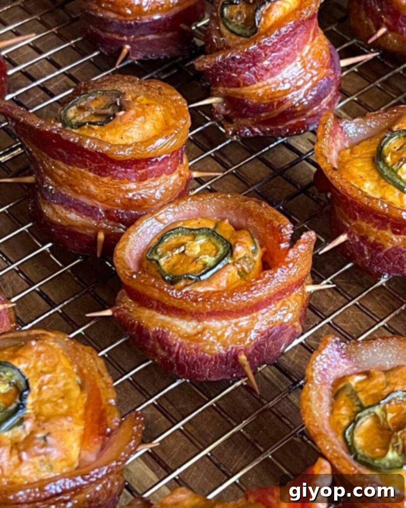 Pitmaster's Piggy Poppers 15 Smoked pig shots on a wire cooling rack.