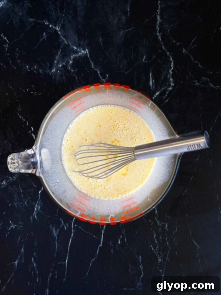 Cheesy Chile Relleno Bake 11 Seasoned egg mixture in a mixing bowl.