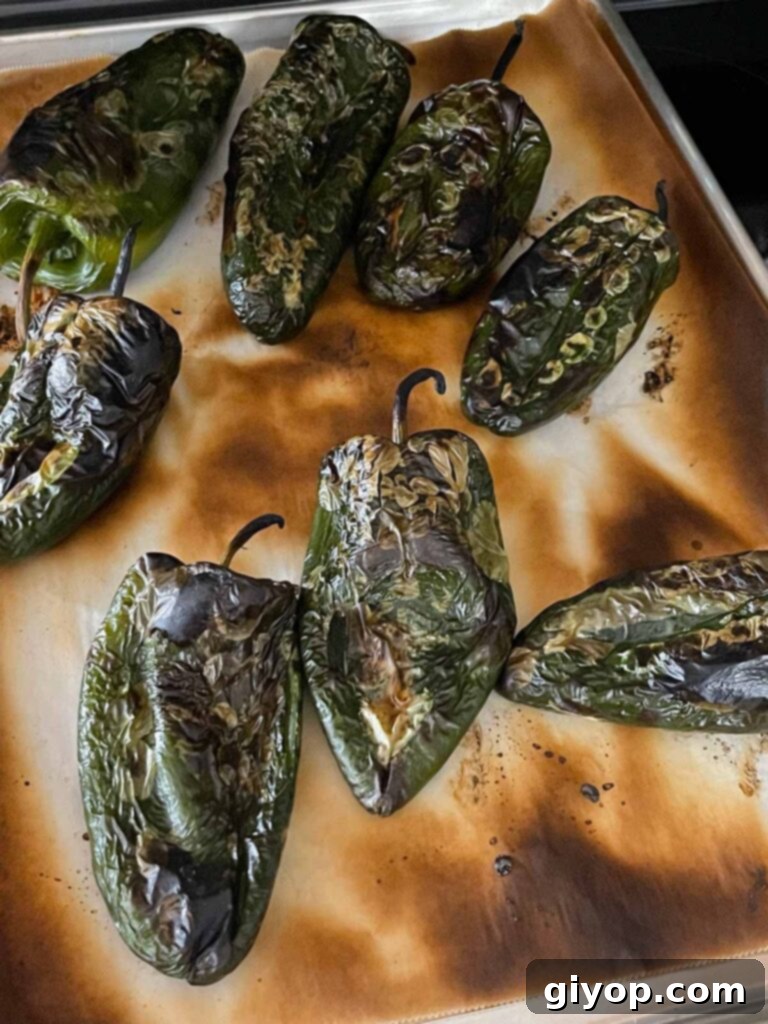 Cheesy Chile Relleno Bake 7 Roasted poblano peppers on a baking sheet.