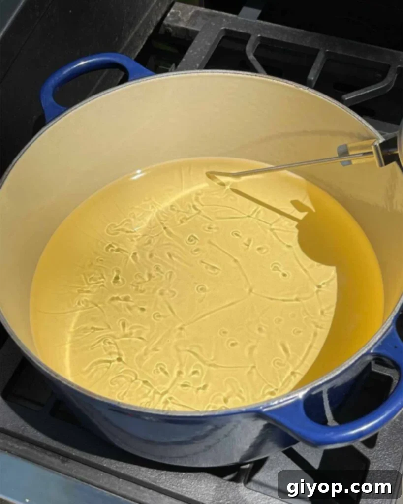 Oil heating in a large dutch oven.