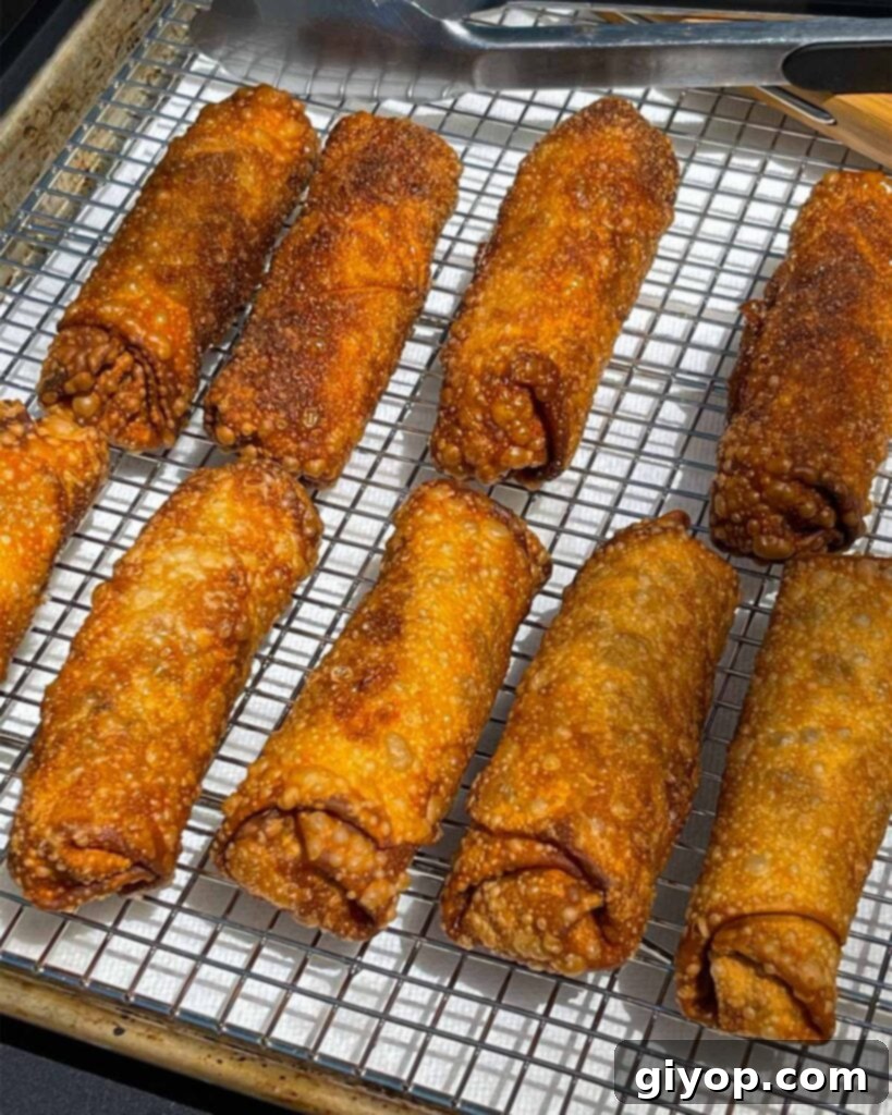 Redneck egg rolls on a wire rack.