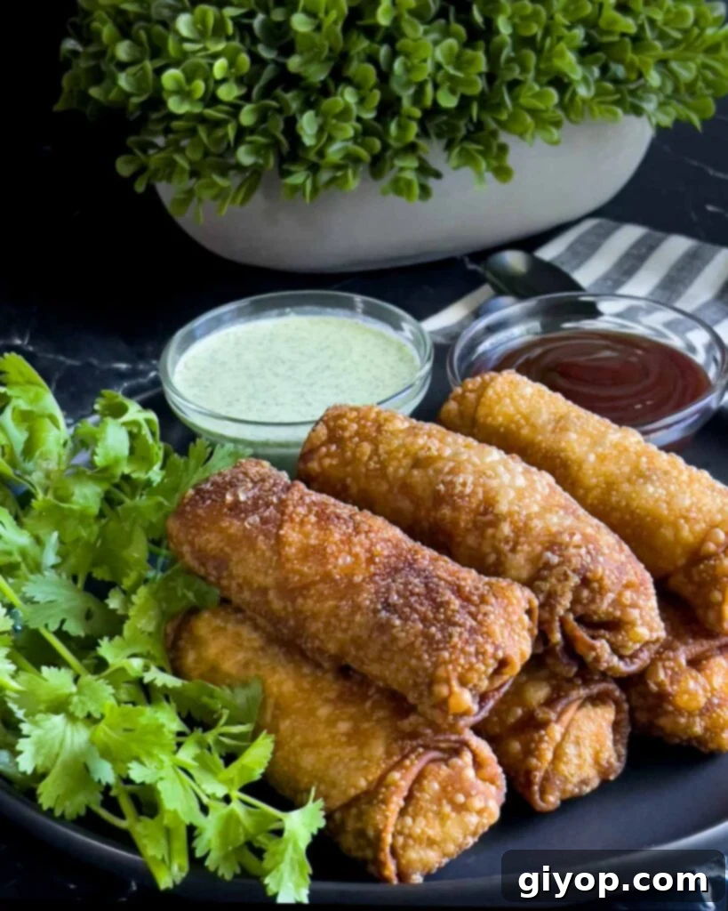 Redneck egg rolls on a dark plate.