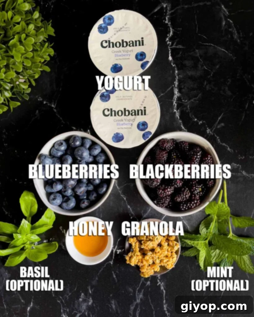 Ingredients for a berry yogurt parfait on a dark surface.