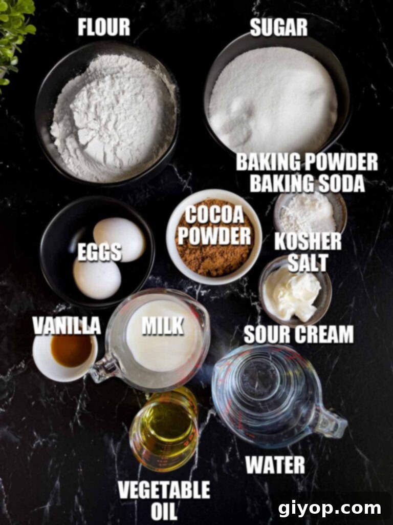 All the dry and wet ingredients for Mississippi Mud Cake laid out on a dark surface, ready for mixing.
