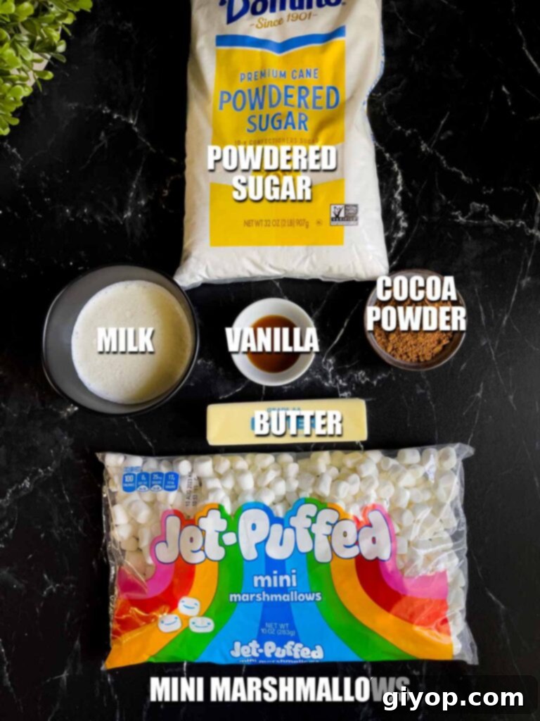 Ingredients for the luscious marshmallow and chocolate icing topping of a Mississippi Mud Cake arranged on a dark surface.