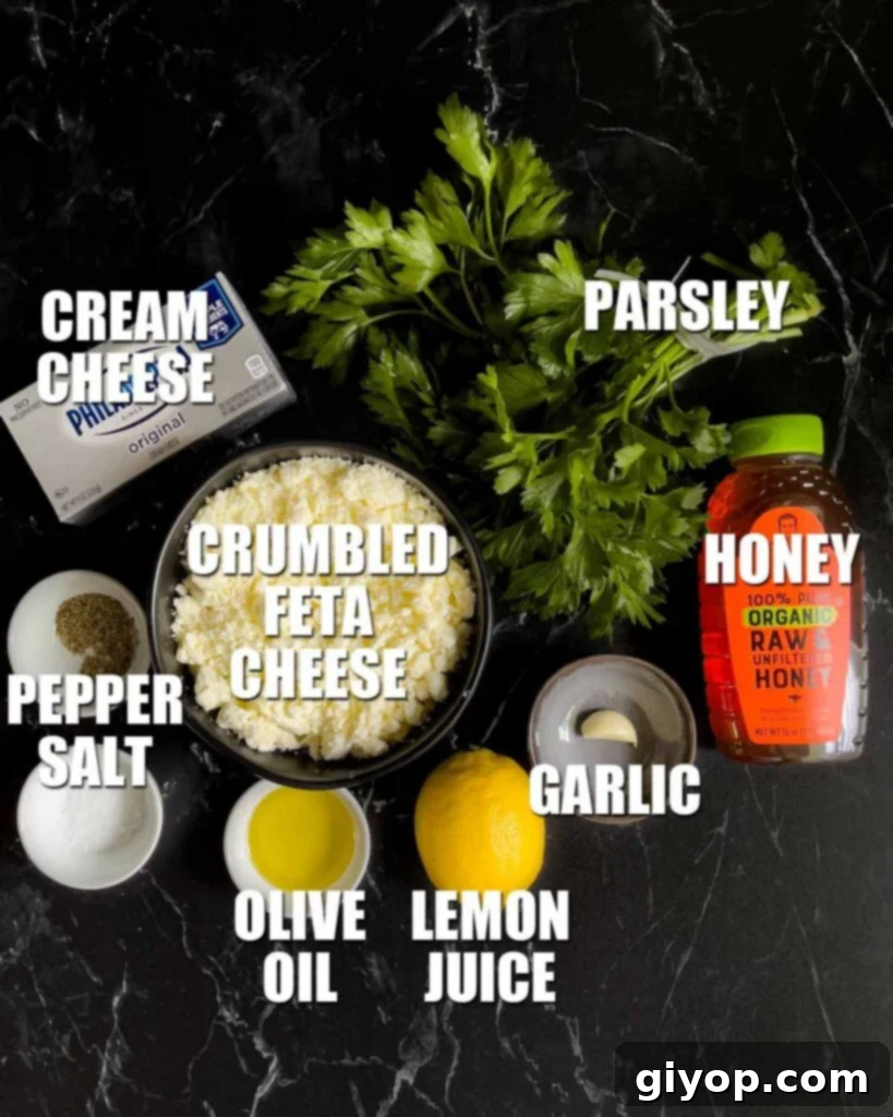 Whipped feta ingredients on a dark surface.
