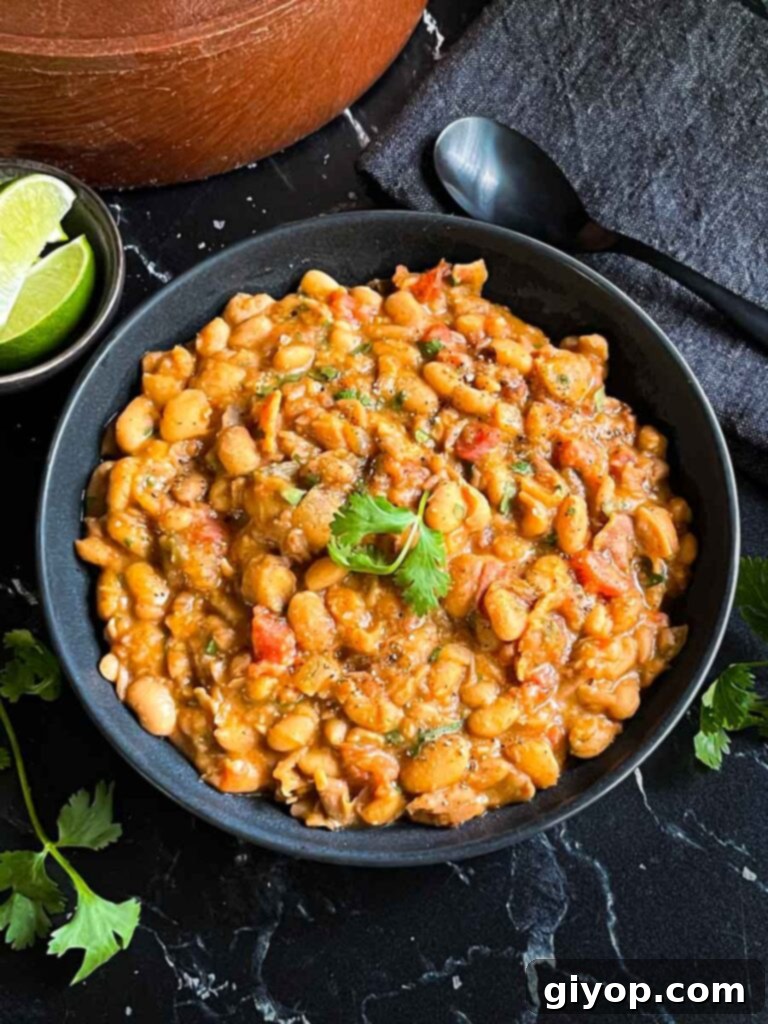 Borracho beans (drunken beans) in a dark bowl.