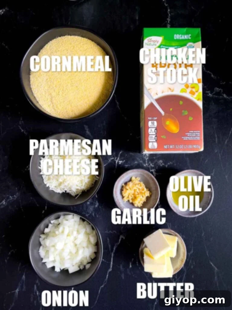 Effortless Creamy Polenta Perfection 4 Ingredients for a basic polenta laid out on a black marble countertop.