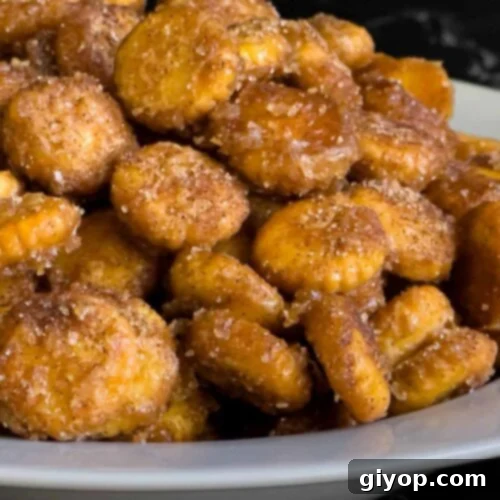 Churro snack mix piled high in a white bowl.