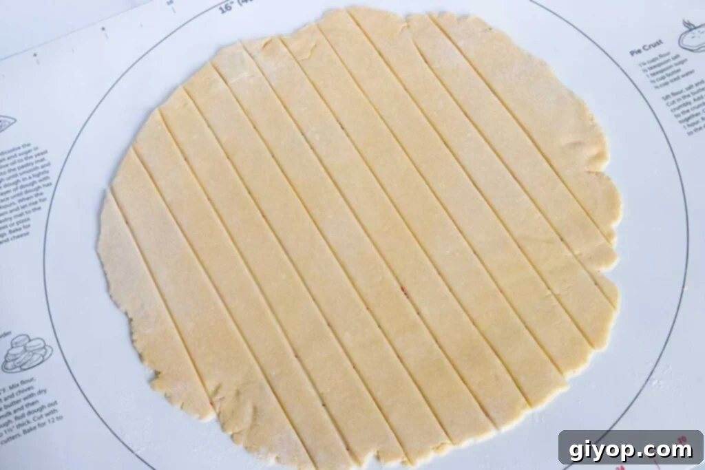 Perfectly Flaky Pie Crust 10 Pie dough rolled into a 12-inch circle and cut into strips for a lattice top.